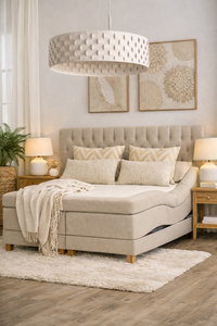 Adjustable Swedish boxspring bed with upholstered headboard in a bright Mediterranean bedroom