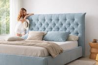 DAFNE tufted upholstered headboard with diamond button design in light blue fabric. DAFNE tufted upholstered headboard with diamond button design in light blue fabric.