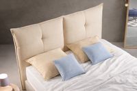 TWIN upholstered headboard with square padded design in soft beige fabric.