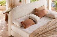 ZOLE curved upholstered headboard with rounded silhouette in textured fabric. ZOLE curved upholstered headboard with rounded silhouette in textured fabric.