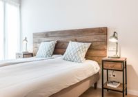 handmade headboard dark wood and bedside table 2