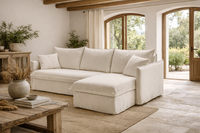 GRACE sofa bed with chaise lounge in a bright Mediterranean-style living room. GRACE sofa bed with chaise lounge in a bright Mediterranean-style living room.